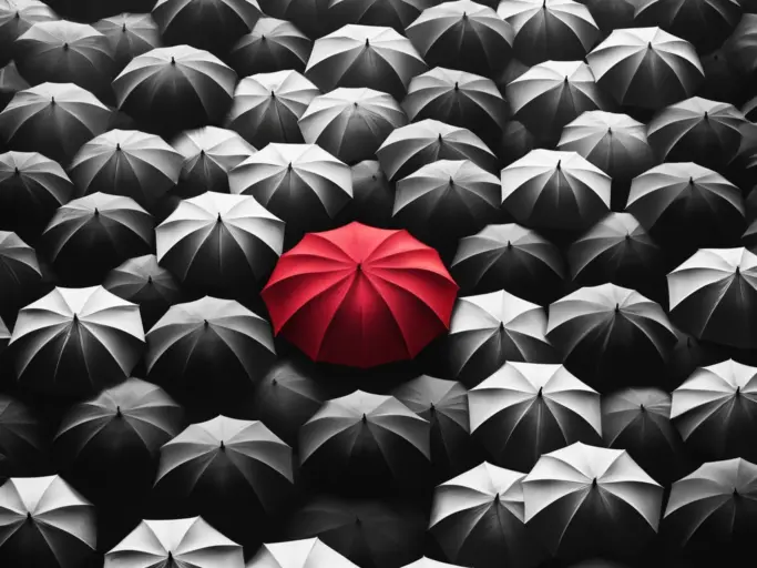 DALL·E 2024 05 26 12.10.43 A black and white depiction of a crowd of umbrellas seen from above. The umbrella in the center is bright red, standing out starkly against the monoch