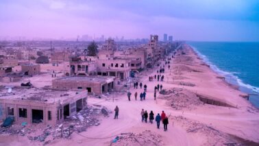 a photo of a war torn city with a desert landscape rUIWtHIATbmclAXDs6UWJQ DFJAPr5KRIudi41 2YngMg